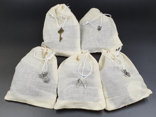 Cotton bags with charms on the drawstring 